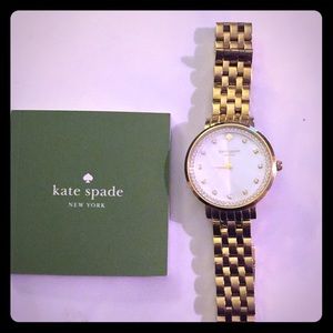 Gold Kate Spade watch with mother of pearl face